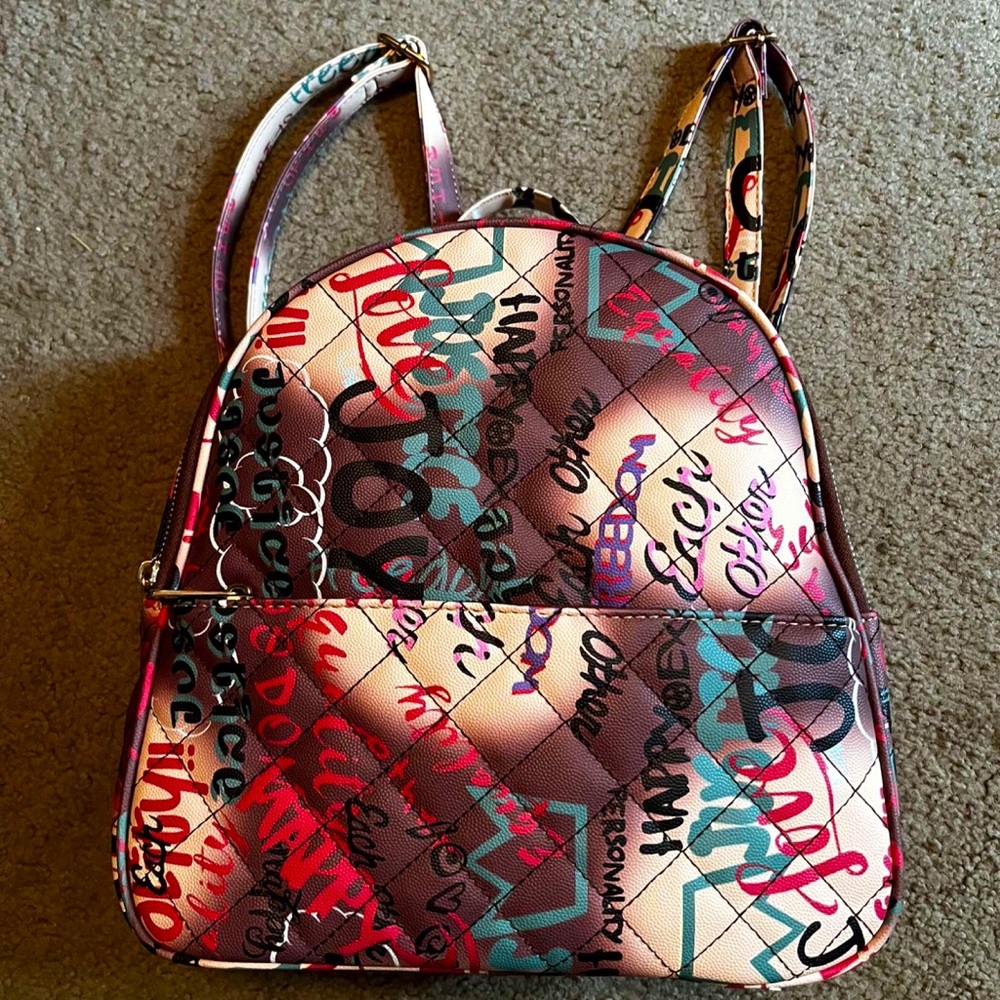 Graphic design multicolored backpack, purse, and matching wallet set